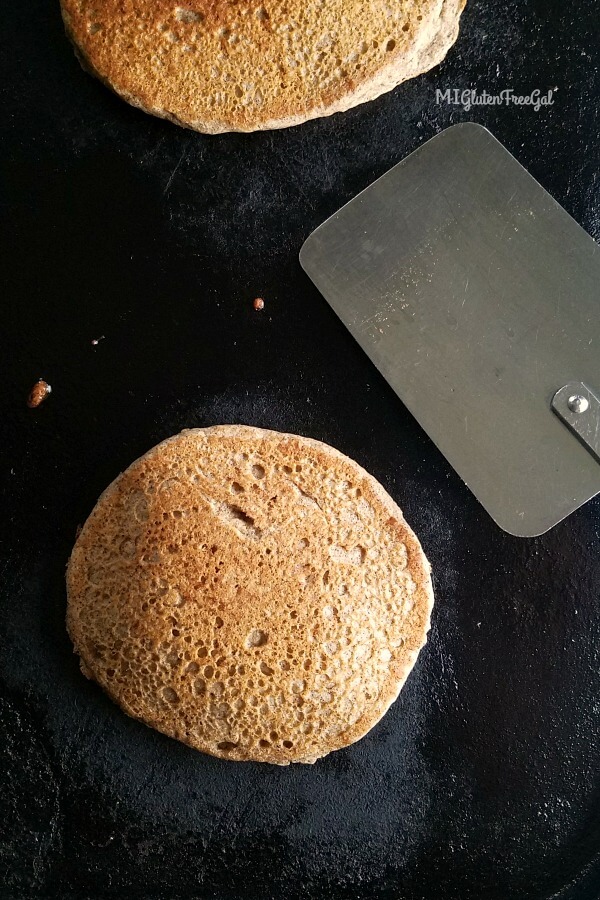 fluffy gluten free buckwheat pancakes on skillet close up