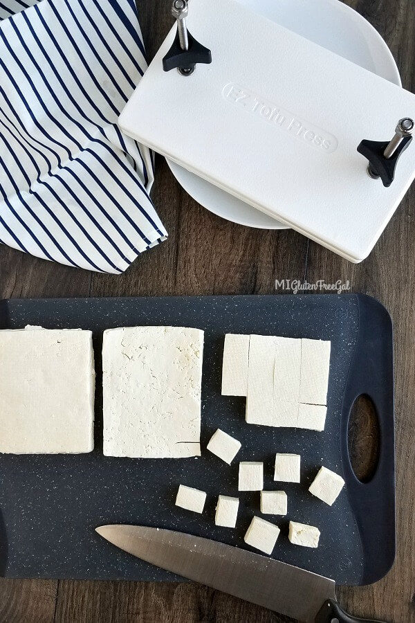 Cubed Tofu on Cutting Board and EZ Tofu Press