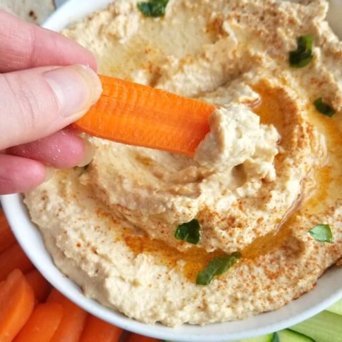 hummus closeup with carrot