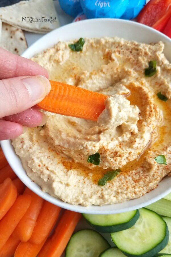 hummus closeup with carrot 