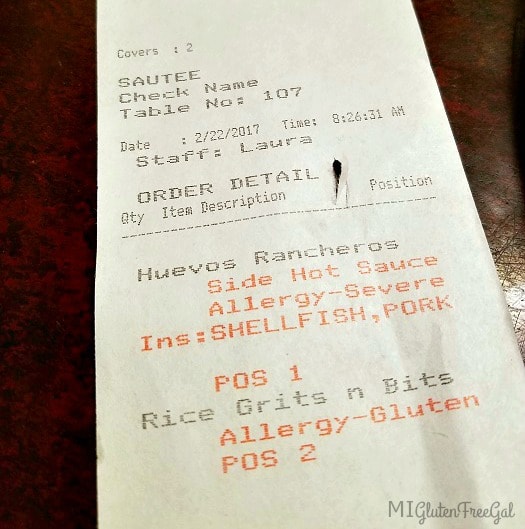 The Point of Sale System at Zingerman's Roadhouse highlights a customer's food allergies in red