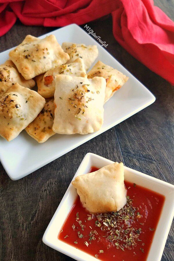 gluten free pizza rolls dipped close up