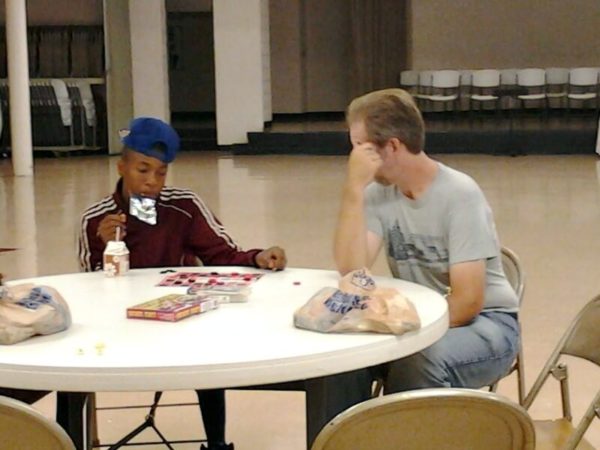 Lucky Antwon and Brad Playing Checkers