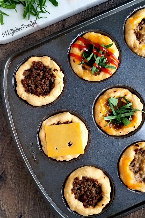 gluten free cheeseburger muffin cups topped in tin