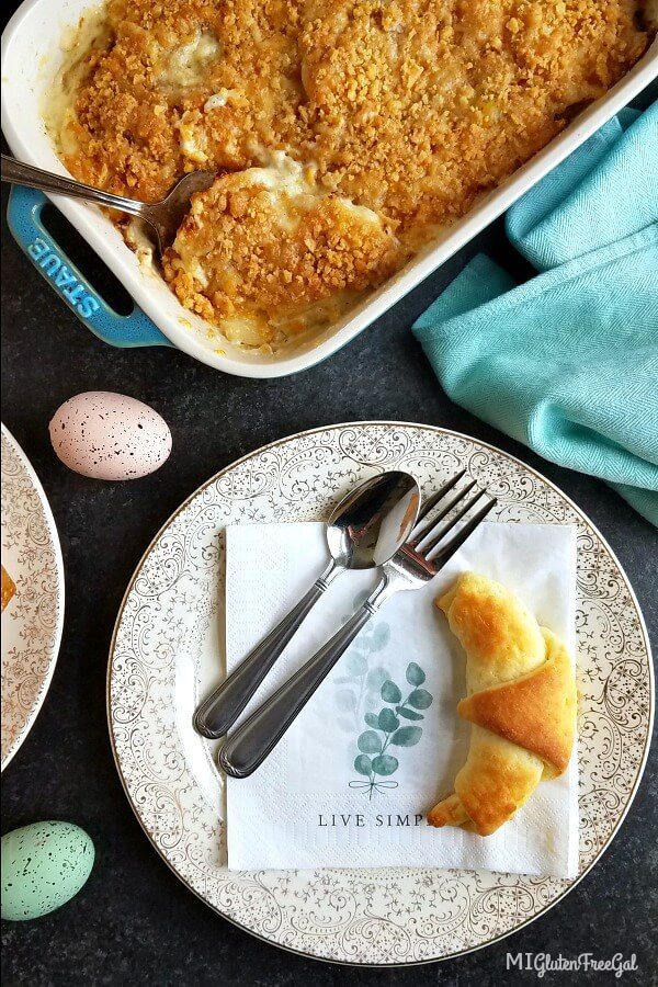 Gluten Free Au Gratin Potatoes with Crescent Roll on Plate