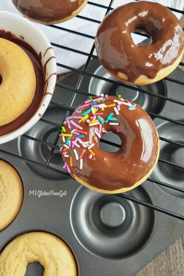 basic gluten free donut recipe dipped in chocolate on cooling rack