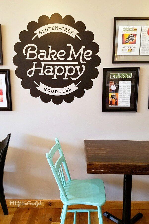 Bake Me Happy gluten free bakery wall logo table and teal chair Columbus Ohio