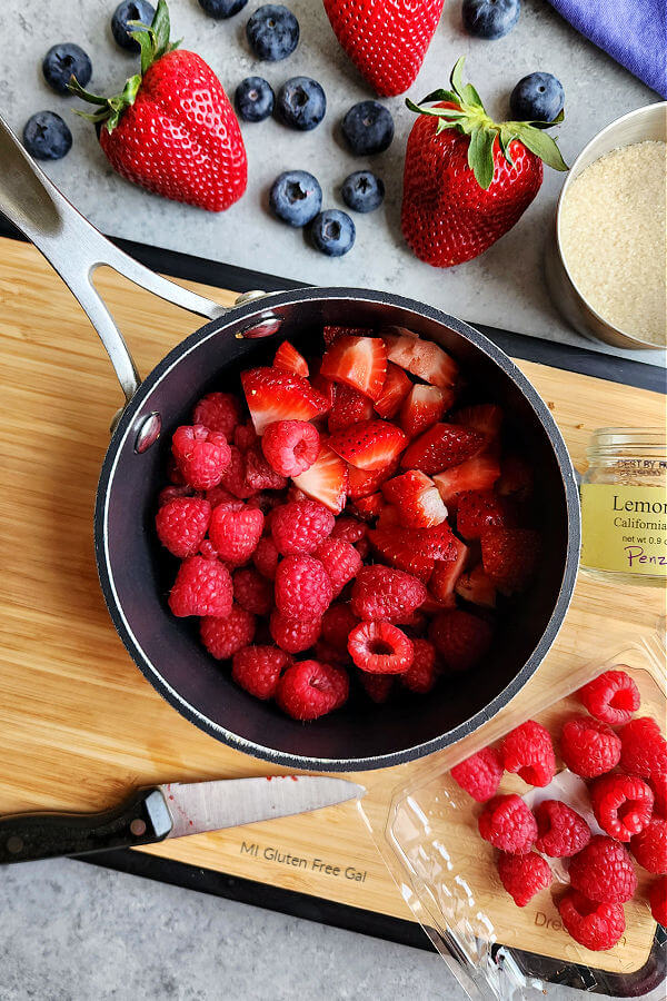 Diced Strawberrie and Raspberries in pot to be cooked down into compote