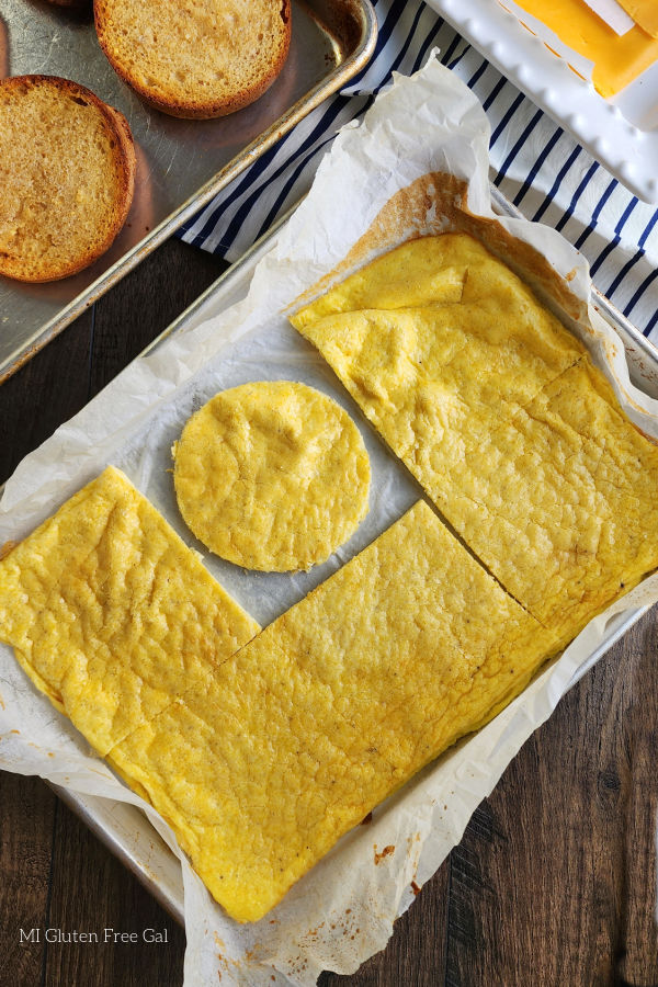 You can cut rounds of baked egg with a cookie cutter or a biscuit cutter to make the perfect gluten free bacon, egg and cheese breakfast sandwich.